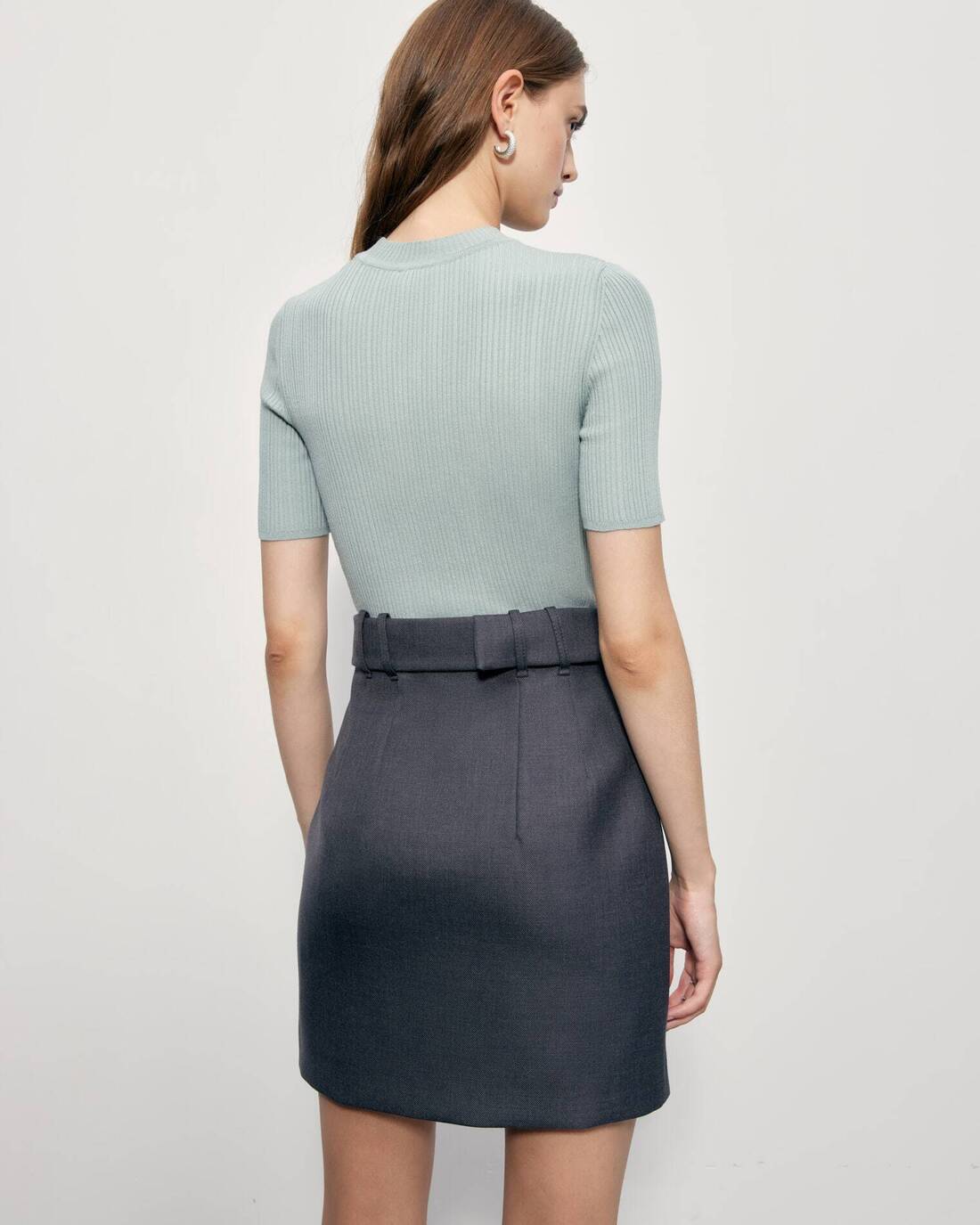 Mini skirt with a square buckle