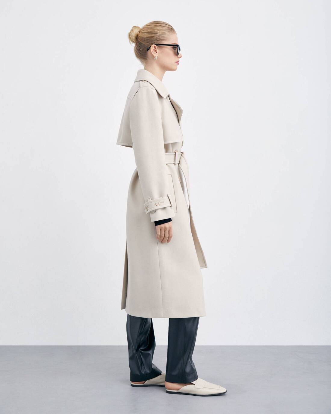Double-breasted trench coat with a double yoke