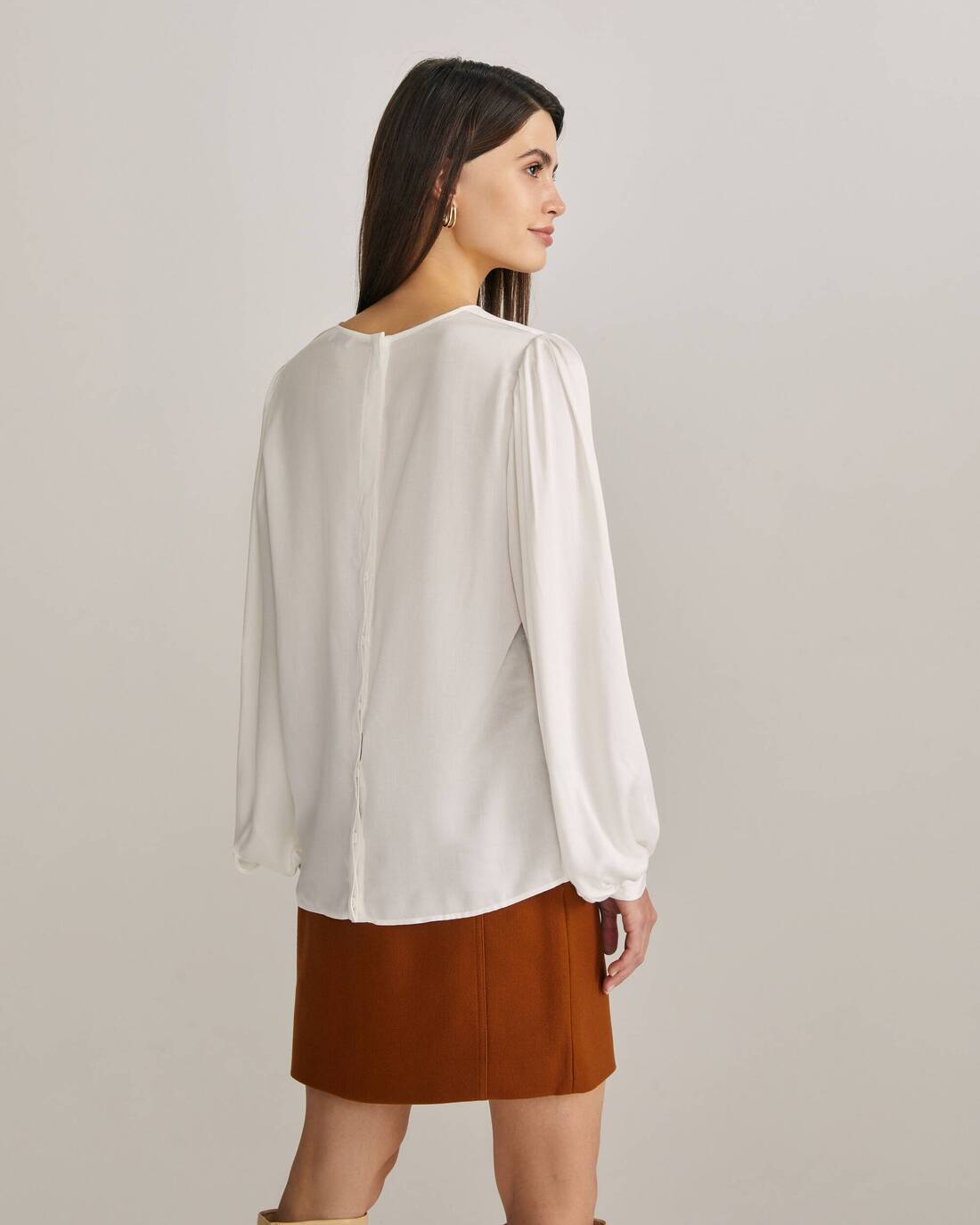 Flowy ruffled blouse with puff sleeves
