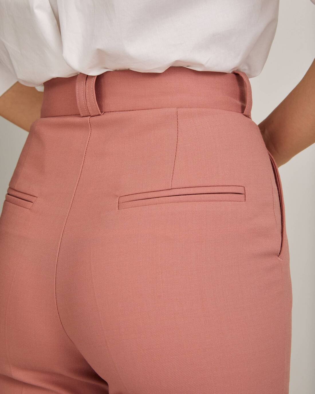 Flared trousers with architectural seams 