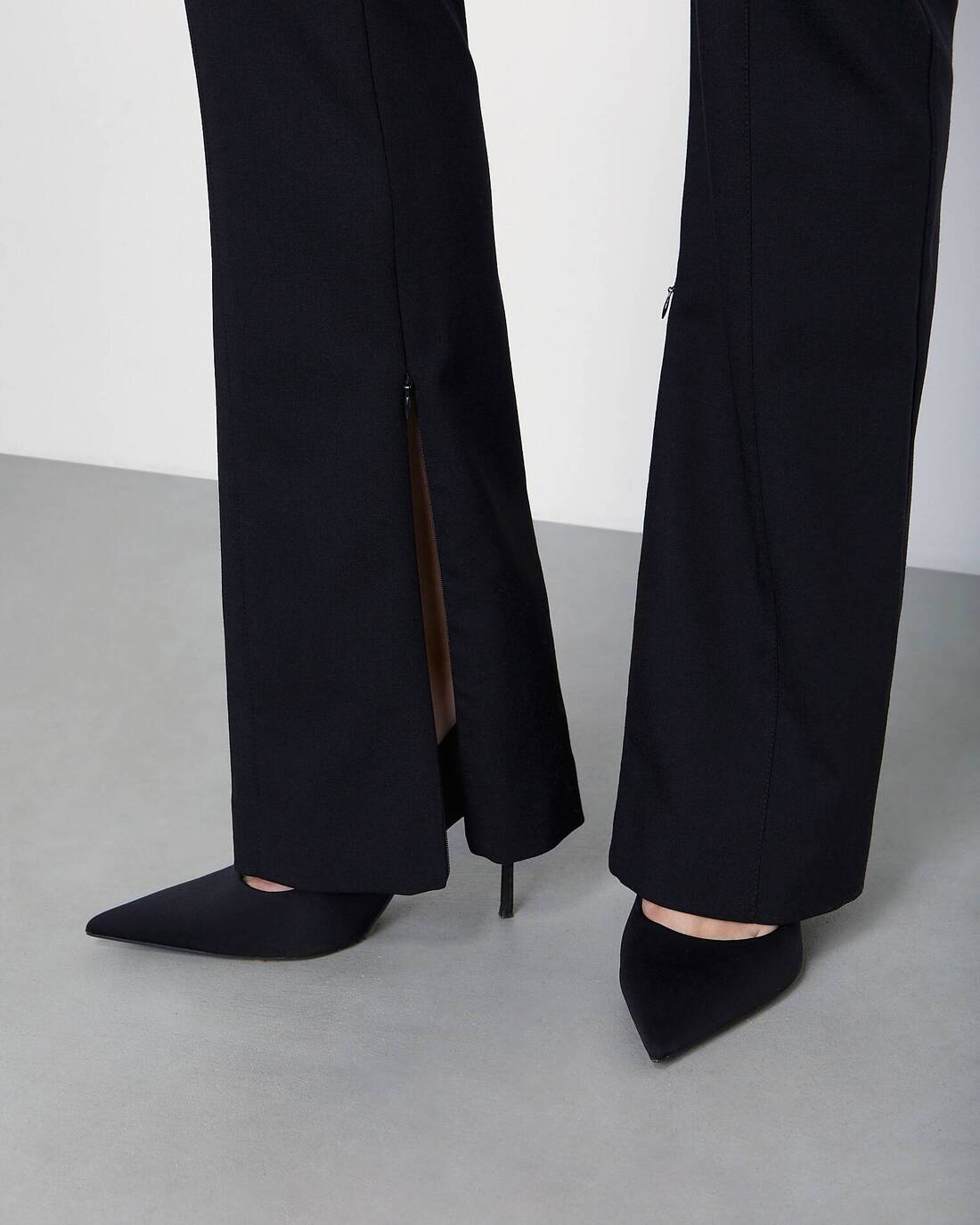 Fitted trousers with slits
