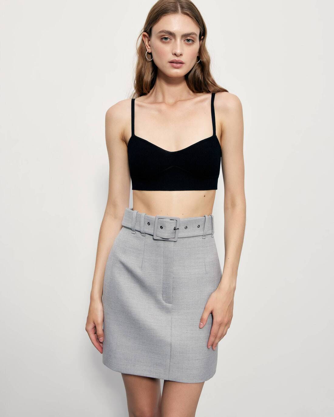 Mini skirt with a square buckle